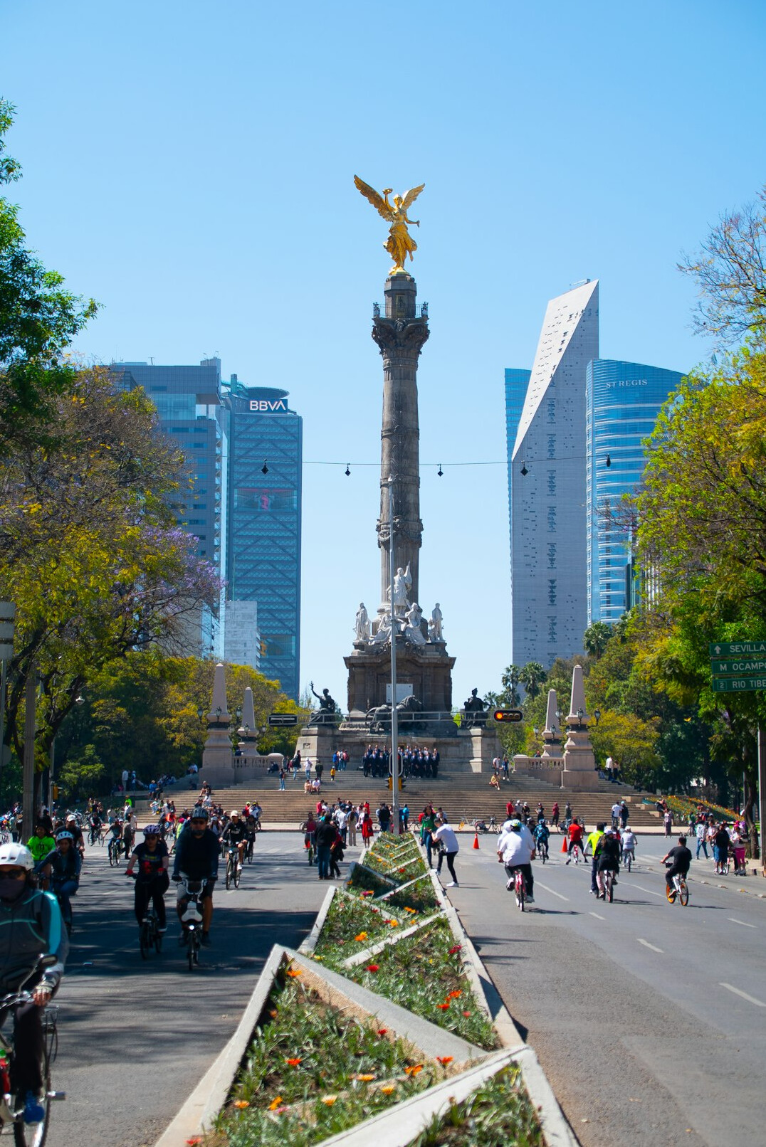 Wide plaza in downtown Santiago full of people walking and sitting