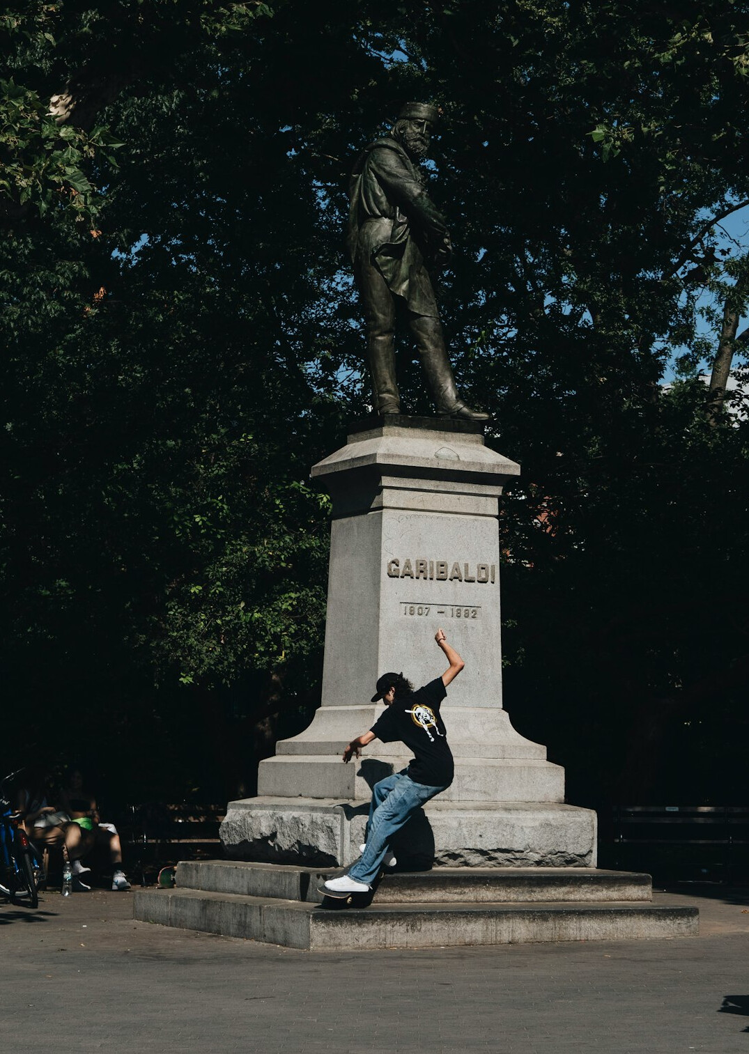 Young Chilean man skateboarding in a public plaza