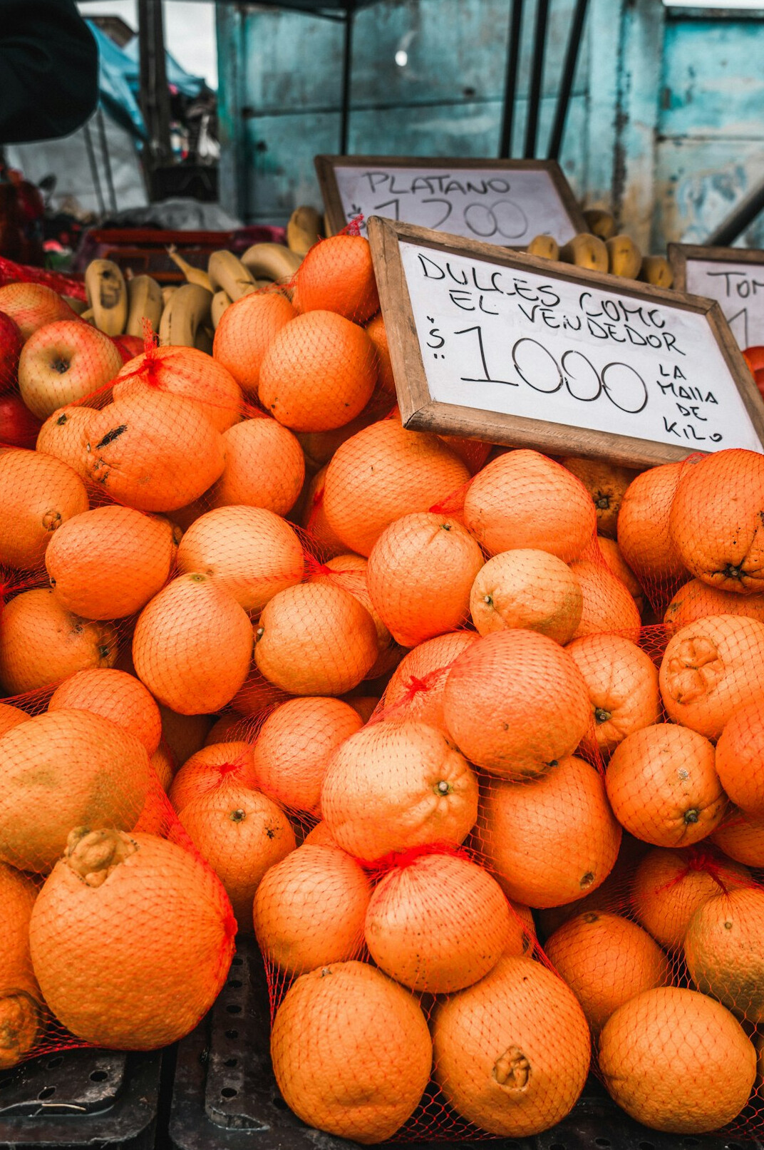 Colorful fruit and vegetable stalls at a busy Chilean market